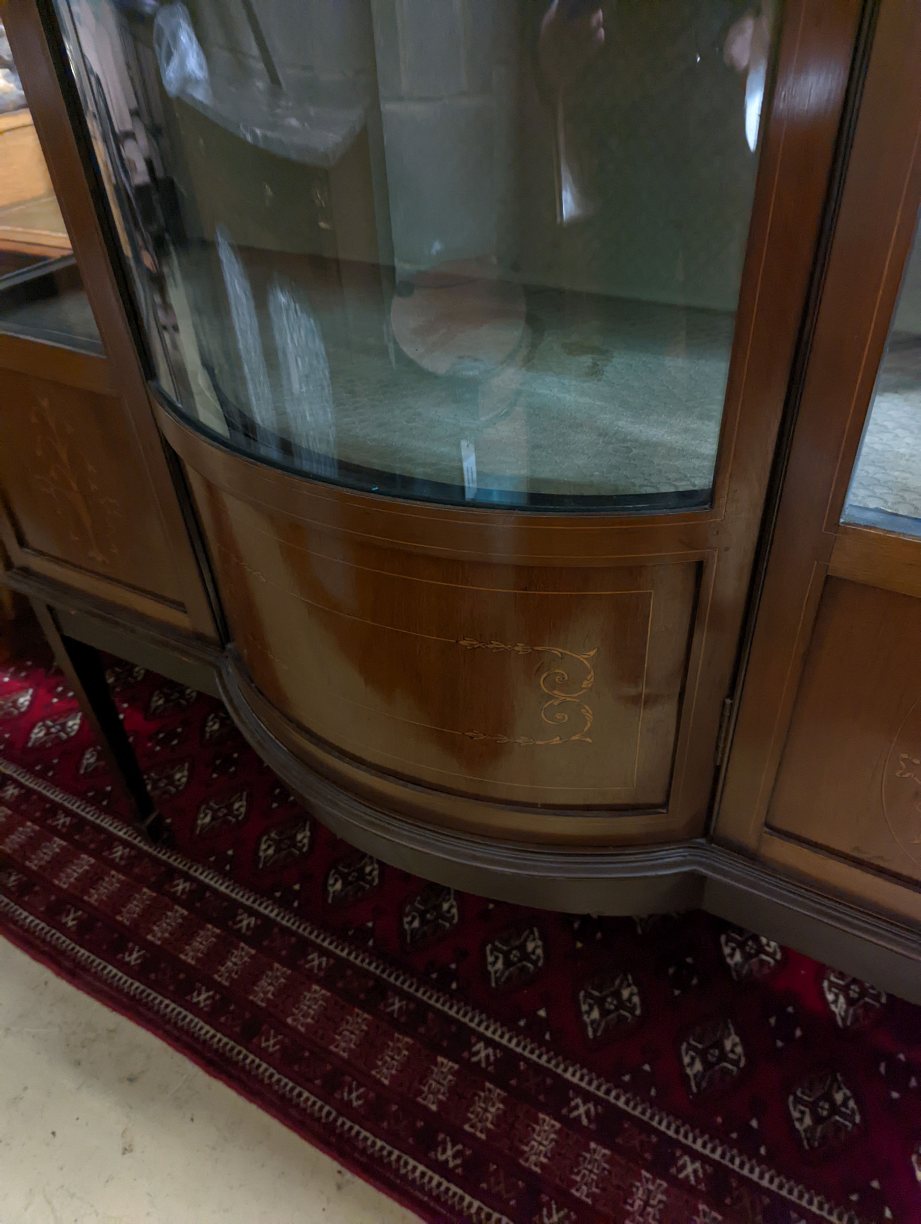 An Edwardian inlaid mahogany bow front display cabinet, width 122cm, depth 48cm, height 196cm